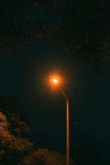 a street light is lit up at night