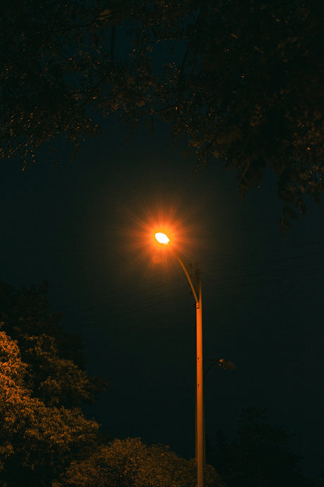 a street light is lit up at night