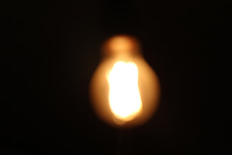 A close up of a light bulb in the dark