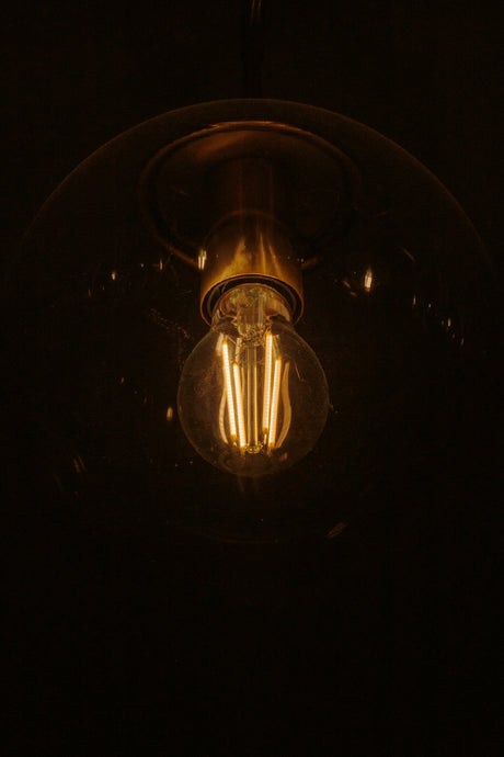 Close-up of an illuminated edison light bulb.
