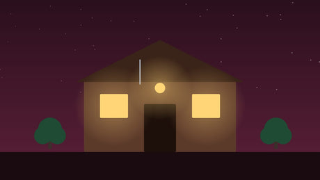 Verlichte schuur in de avond met warme lampen
