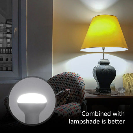 Aigostar R80 daylight white reflector bulb in a cozy living room with a lamp and shadow