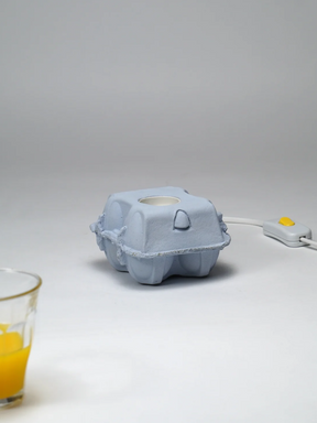 EggboxLAMP Sky LED lamp in blue with a unique egg-shaped design and switch for modern lighting